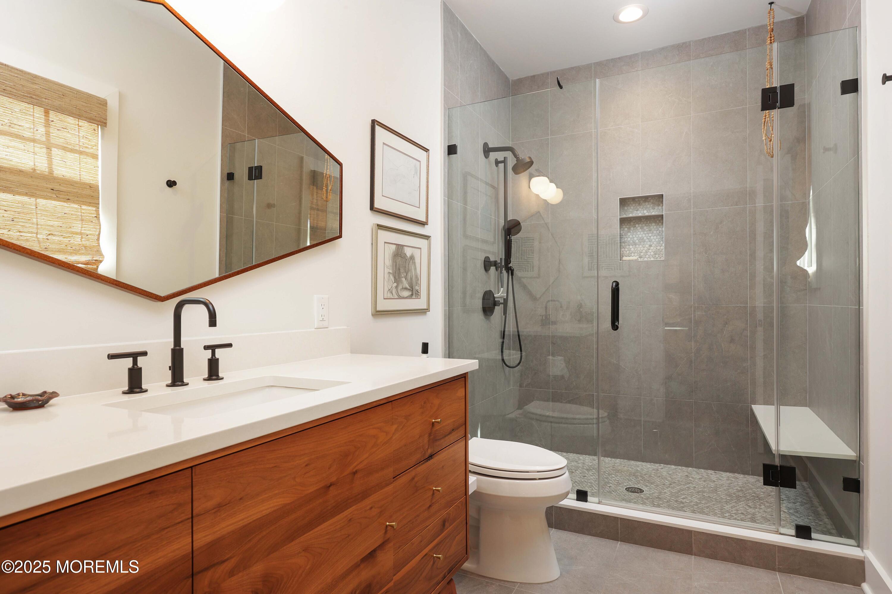 41 Forrest Avenue Rumson, NJ 07760 - Photo 13 of 32 a bathroom with a sink a toilet and shower