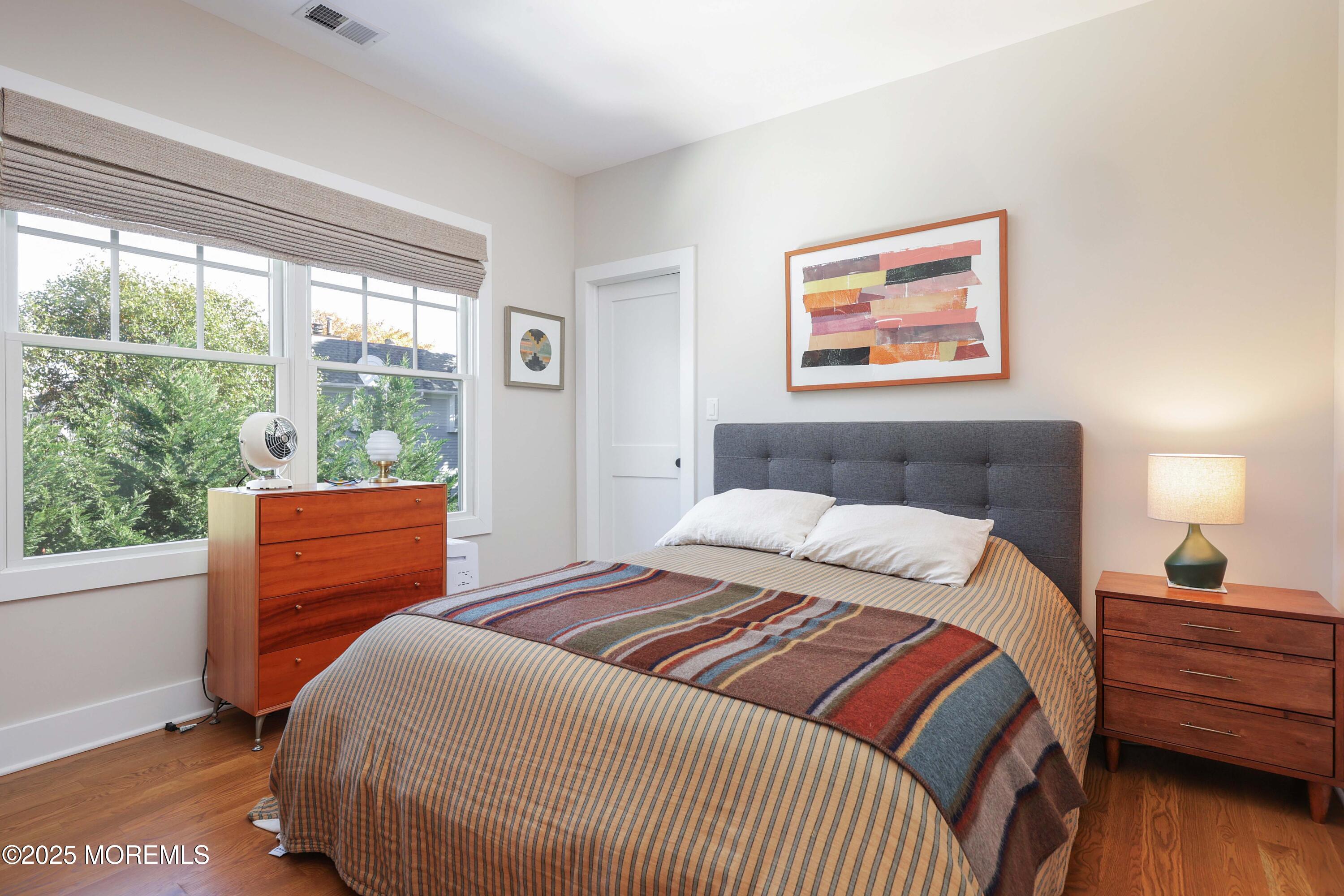 41 Forrest Avenue Rumson, NJ 07760 - Photo 14 of 32 a bedroom with a bed and wooden floor