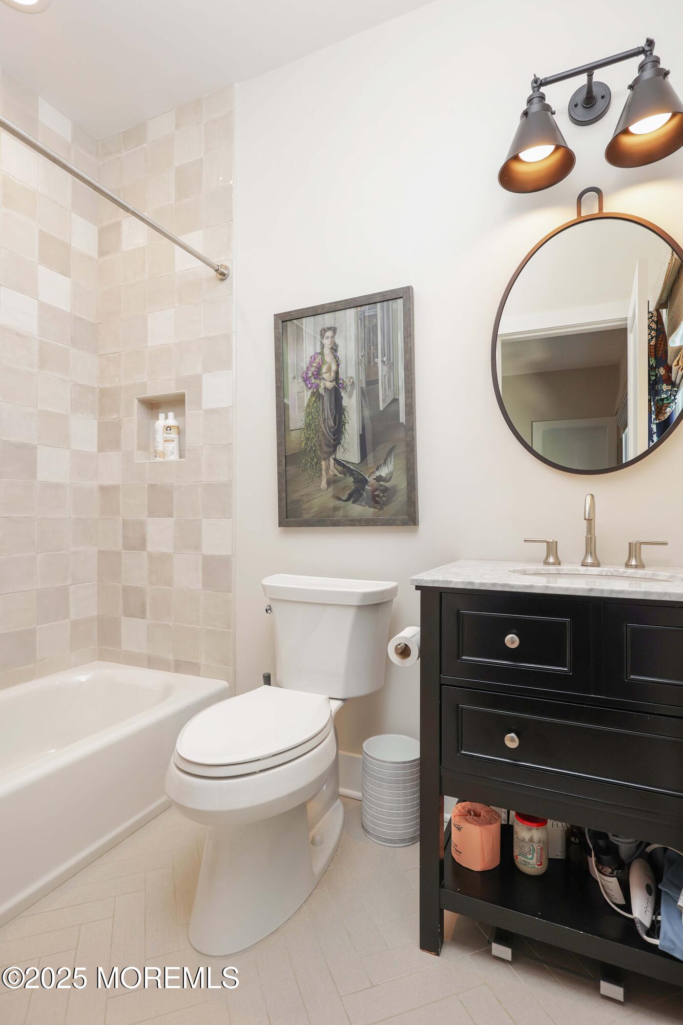 41 Forrest Avenue Rumson, NJ 07760 - Photo 15 of 32 a bathroom with a toilet a sink and a mirror