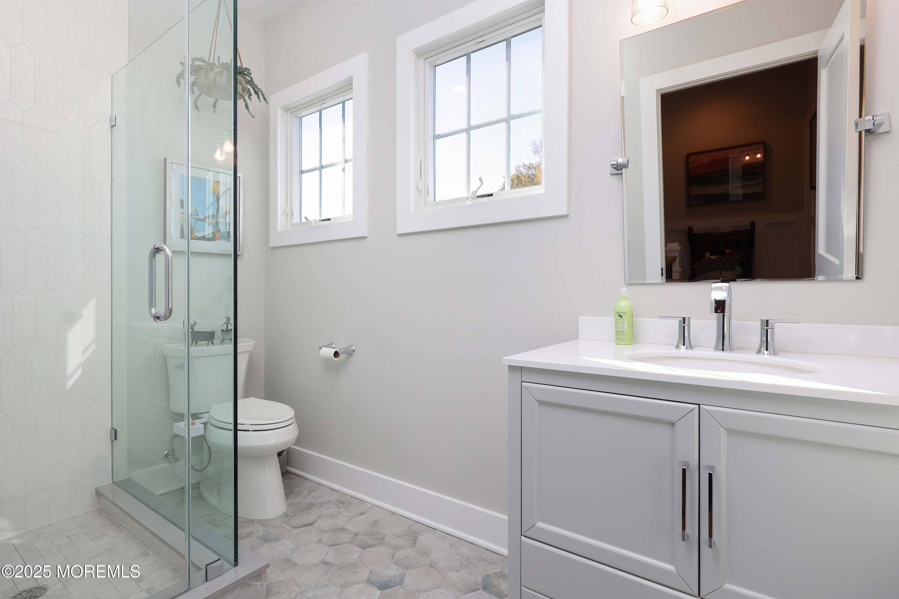 41 Forrest Avenue Rumson, NJ 07760 - Photo 17 of 32 a bathroom with a sink and a mirror
