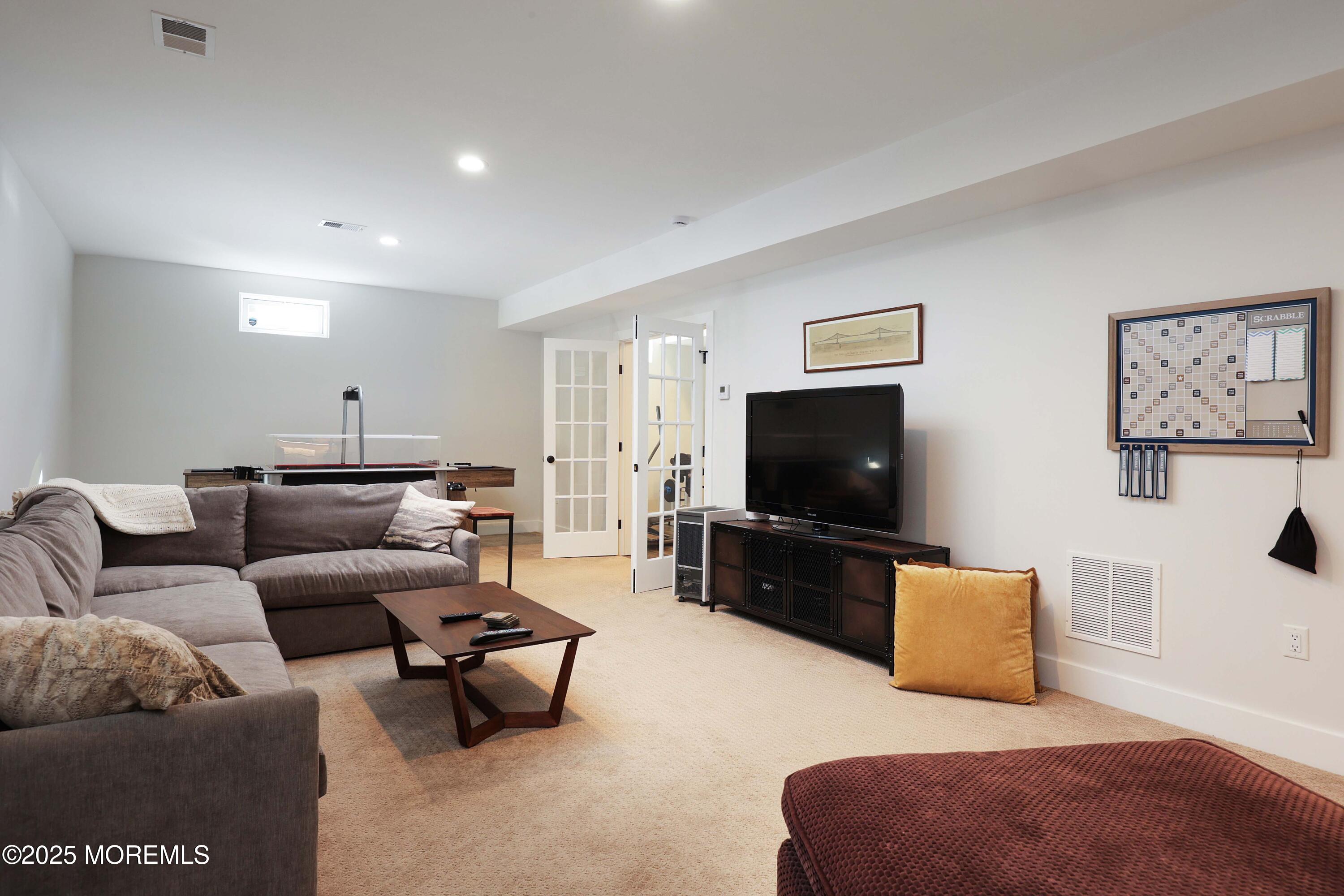 41 Forrest Avenue Rumson, NJ 07760 - Photo 20 of 32 a living room with furniture and a flat screen tv