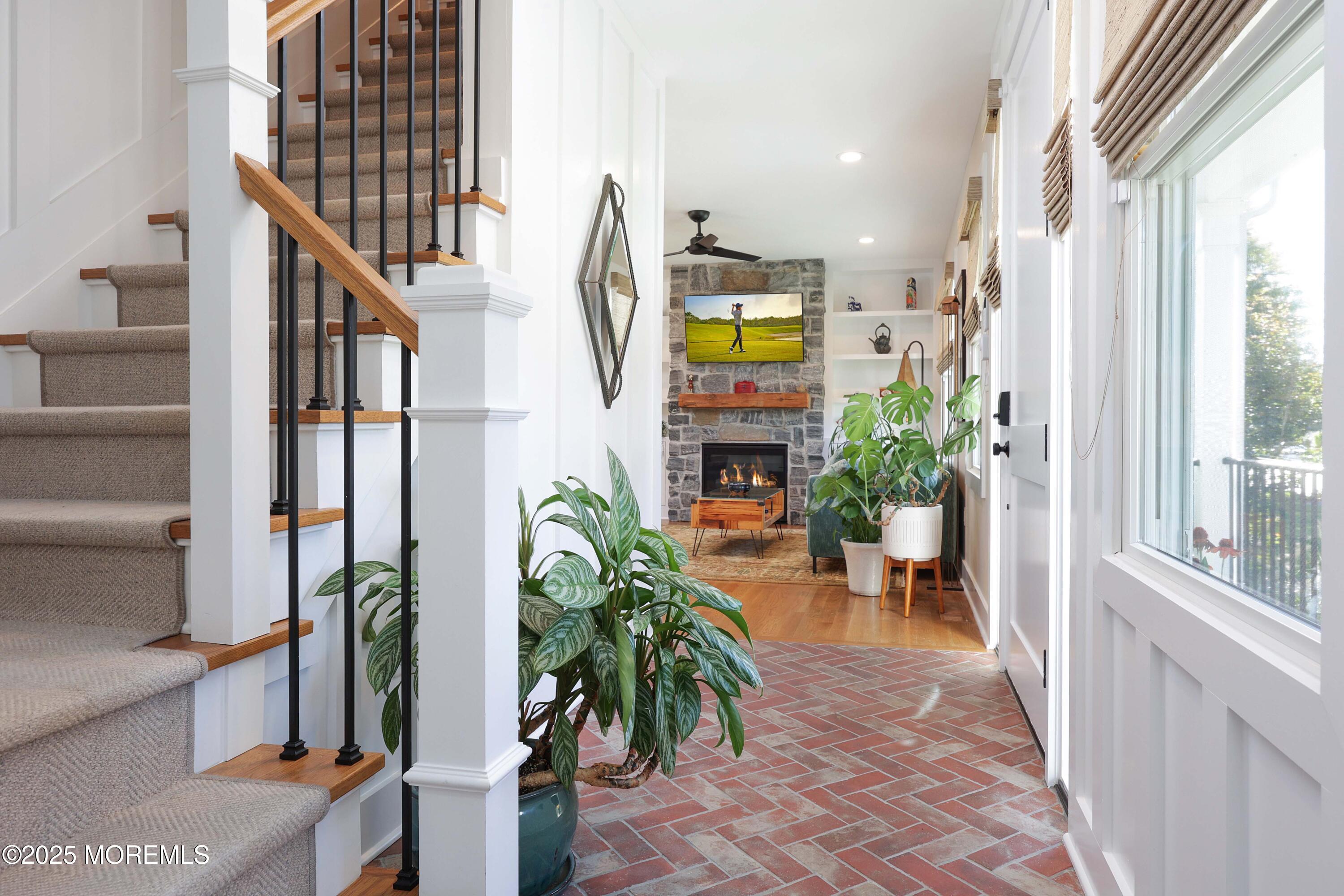 41 Forrest Avenue Rumson, NJ 07760 - Photo 2 of 32 a living room filled with furniture and a potted plant