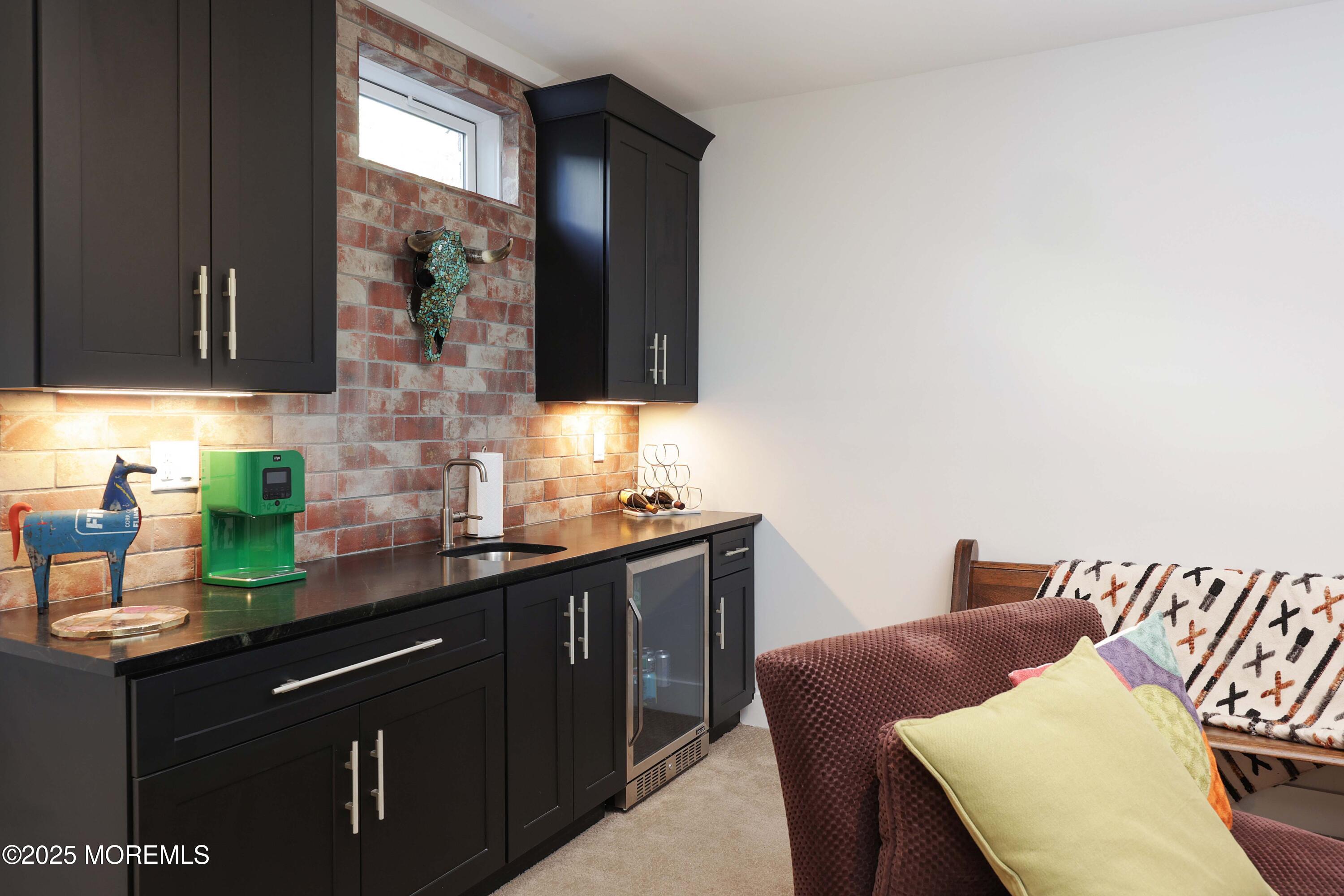 41 Forrest Avenue Rumson, NJ 07760 - Photo 21 of 32 a kitchen with stainless steel appliances granite countertop a sink and a microwave