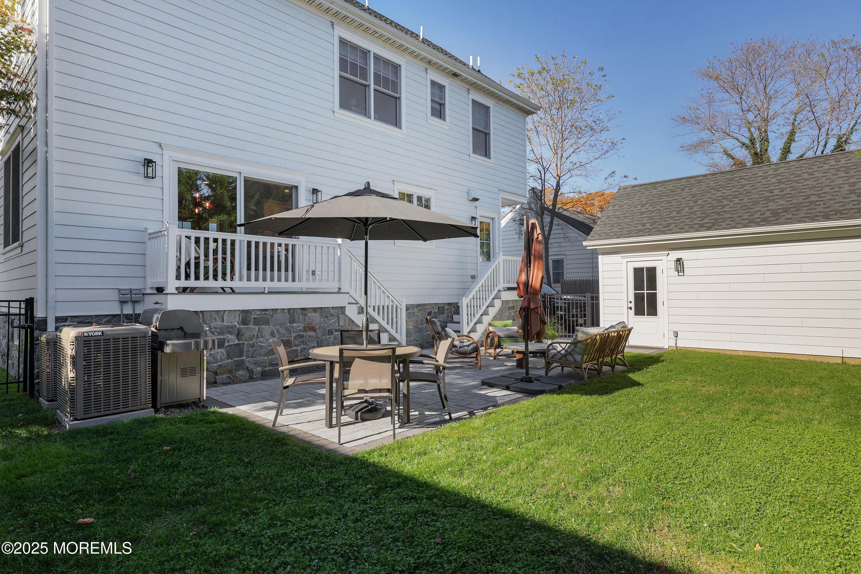 41 Forrest Avenue Rumson, NJ 07760 - Photo 26 of 32 a view of a house with a yard and sitting area