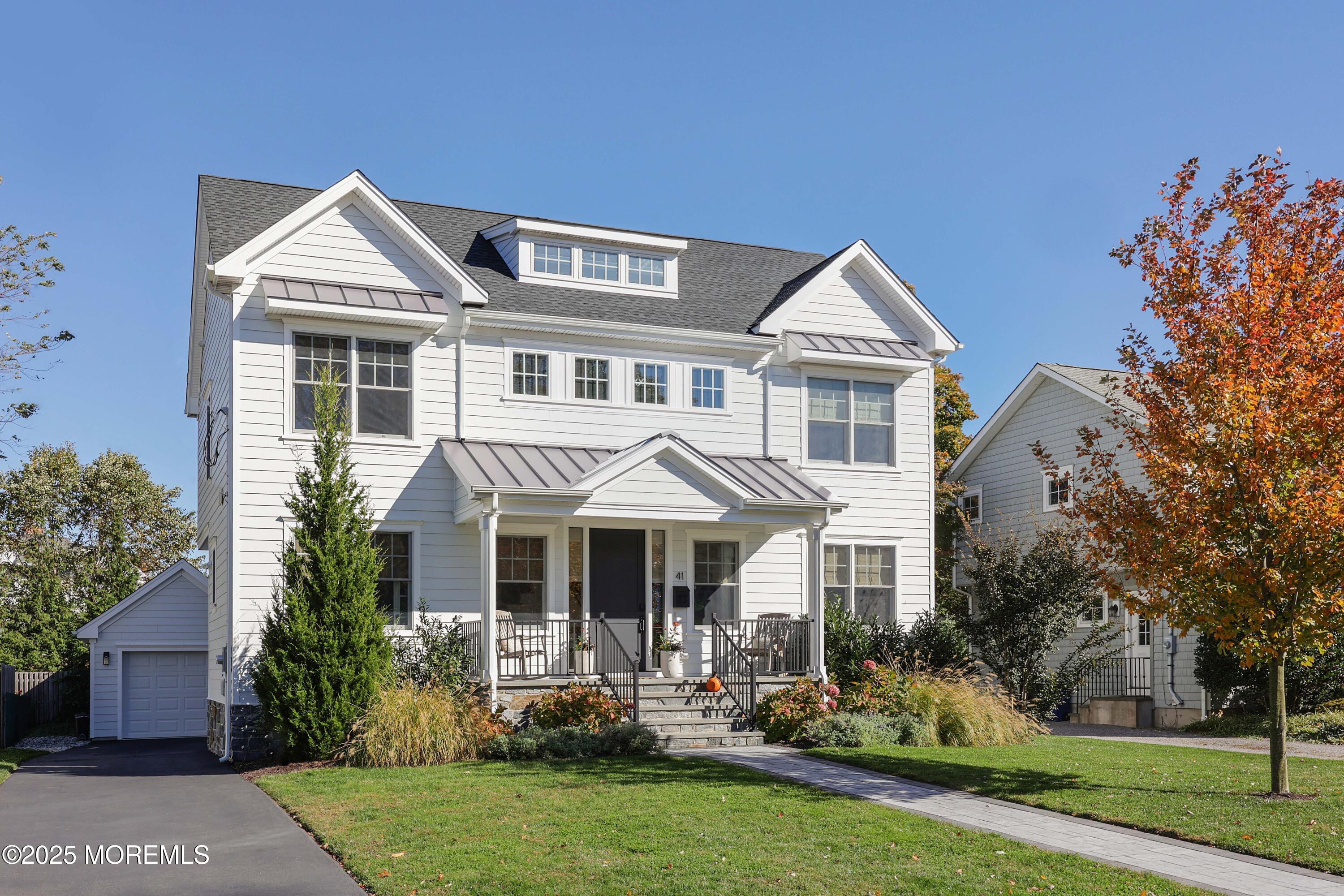 41 Forrest Avenue Rumson, NJ 07760 - Photo 28 of 32 front view of a house with a yard