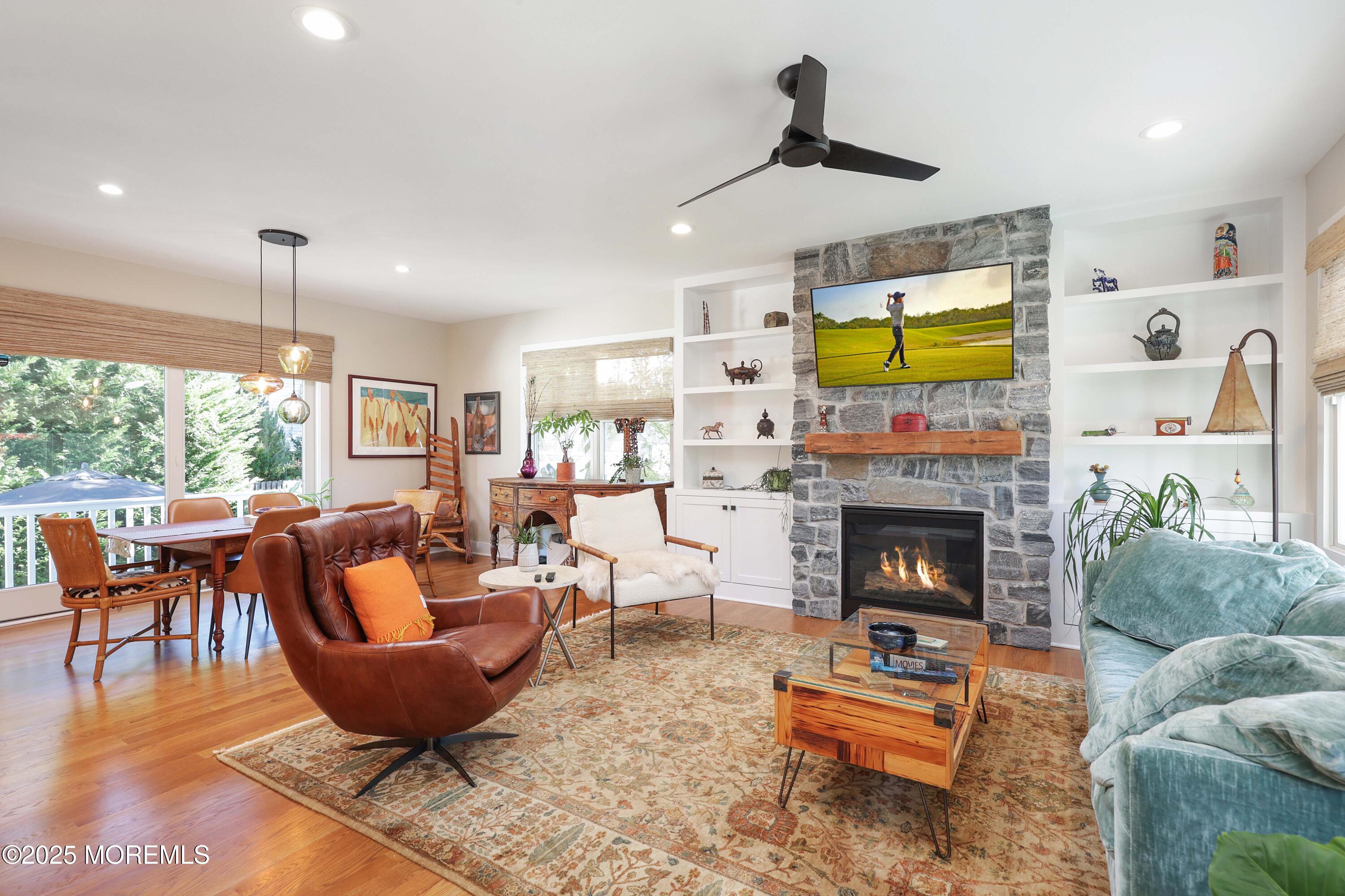 41 Forrest Avenue Rumson, NJ 07760 - Photo 4 of 32 a living room with furniture a fireplace and a table