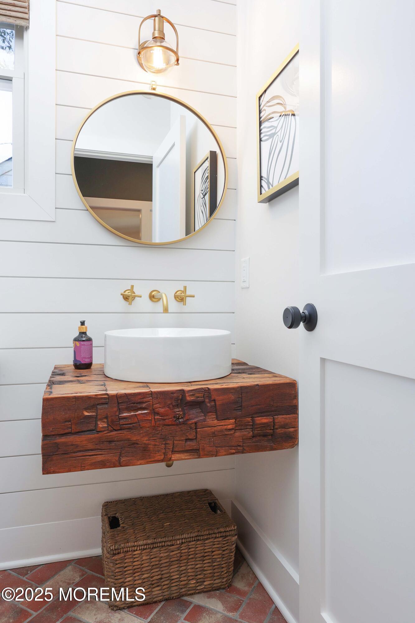 41 Forrest Avenue Rumson, NJ 07760 - Photo 9 of 32 a bathroom with a sink and a mirror