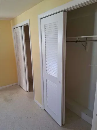 a view of empty room with windows