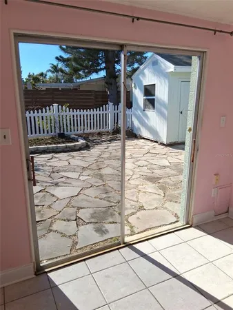 a view of a hallway with a window