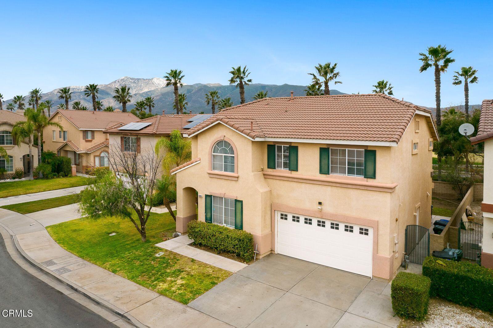 16740 Inverrary Way Fontana, CA 92336 - Photo 2 of 29 a front view of a house with garden