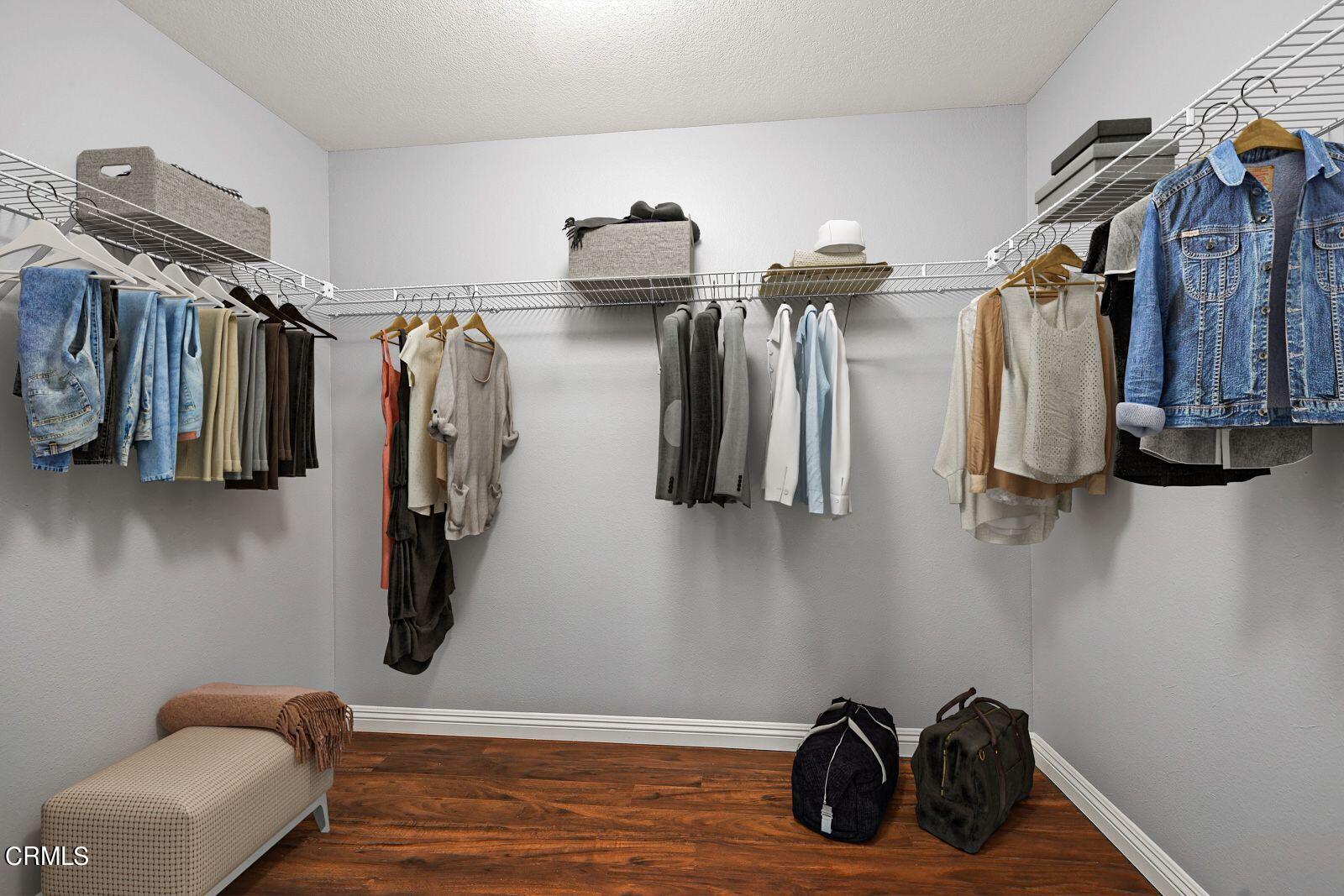 16740 Inverrary Way Fontana, CA 92336 - Photo 16 of 29 a view of walk in closet with clothes and shoes