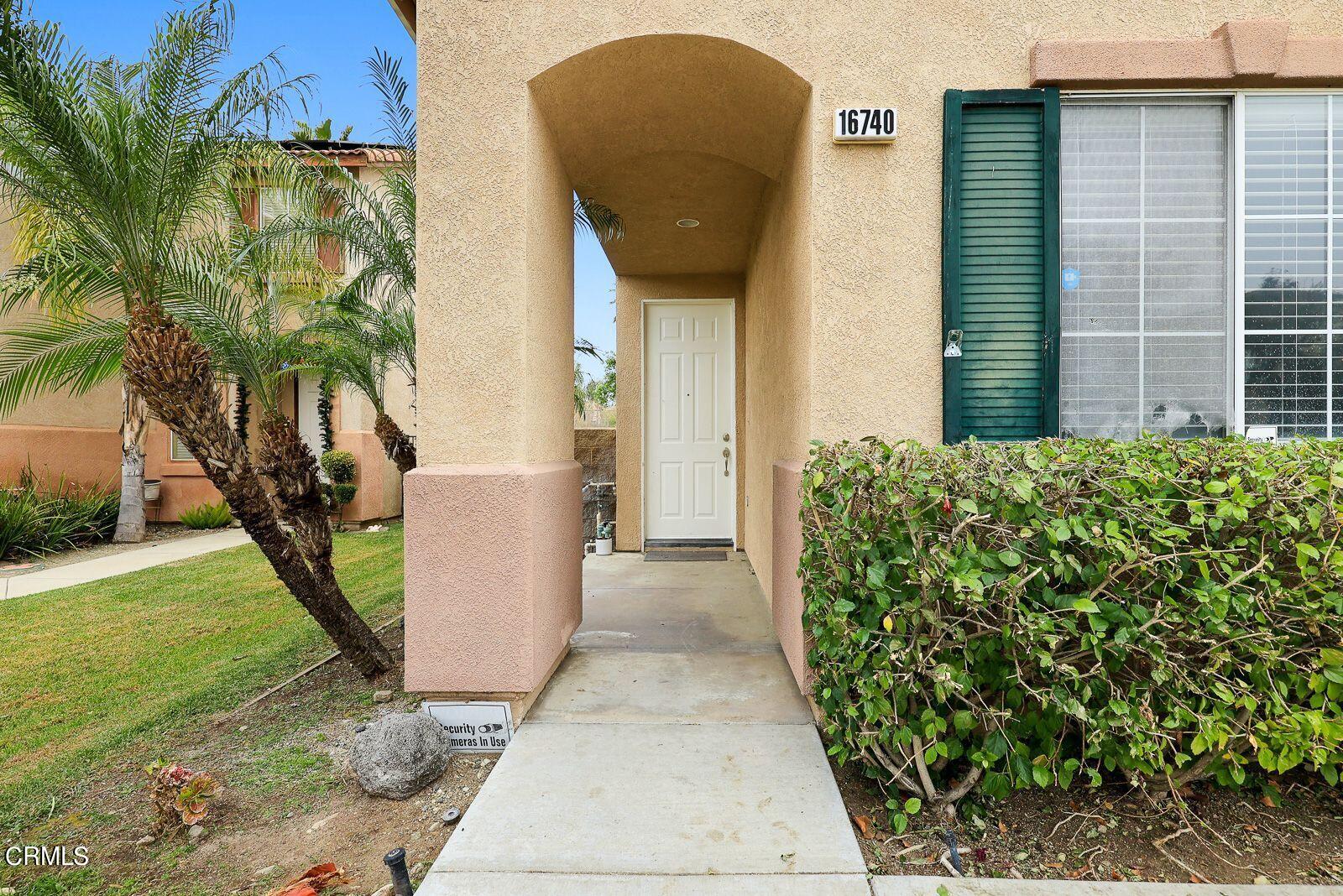 16740 Inverrary Way Fontana, CA 92336 - Photo 3 of 29 a view of a entryway door of the house
