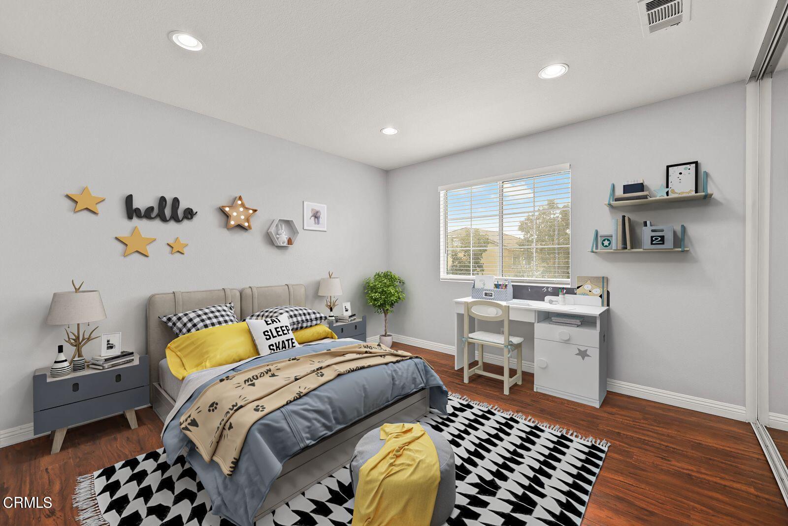16740 Inverrary Way Fontana, CA 92336 - Photo 21 of 29 a bedroom with a bed and wooden floor