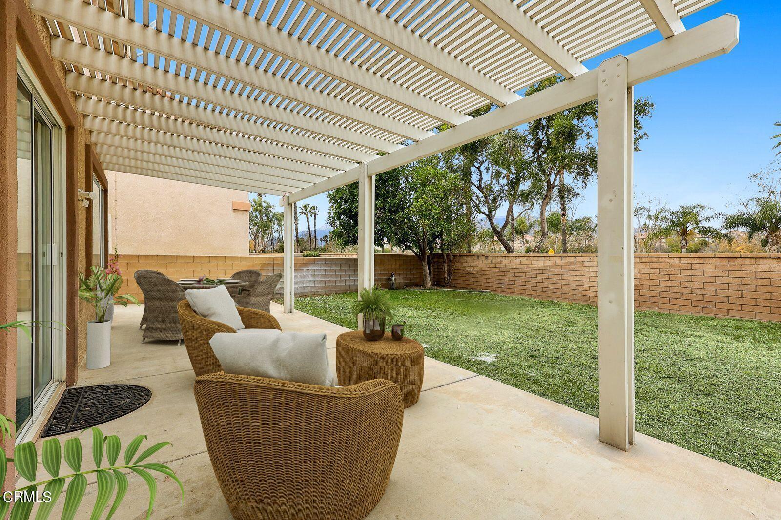 16740 Inverrary Way Fontana, CA 92336 - Photo 24 of 29 a patio with yard table and chairs
