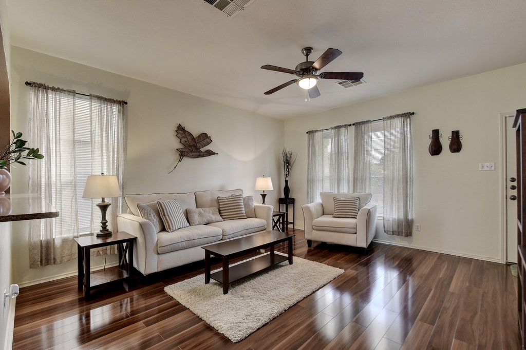 2201 Keepsake Drive Austin, TX 78745 - Photo 4 of 25 a living room with furniture and a wooden floor