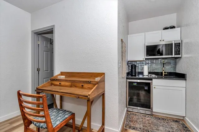a kitchen with stainless steel appliances a stove a sink and a microwave