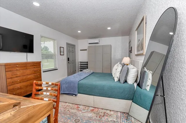 a bedroom with a bed and furniture