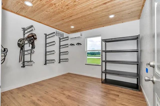 a view of a room with a wooden floor