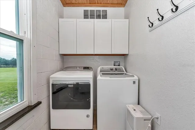 a utility room with dryer and washer