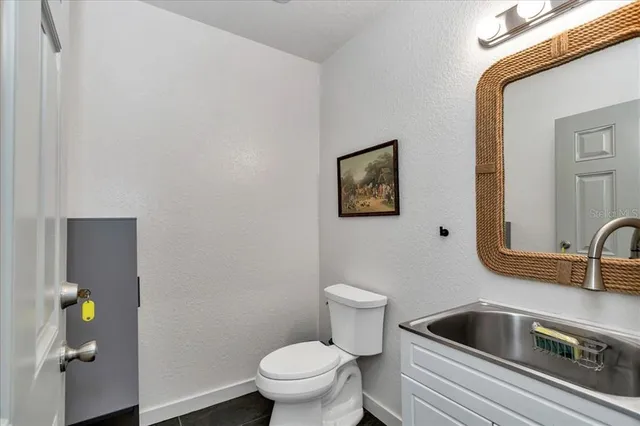a bathroom with a toilet and sink