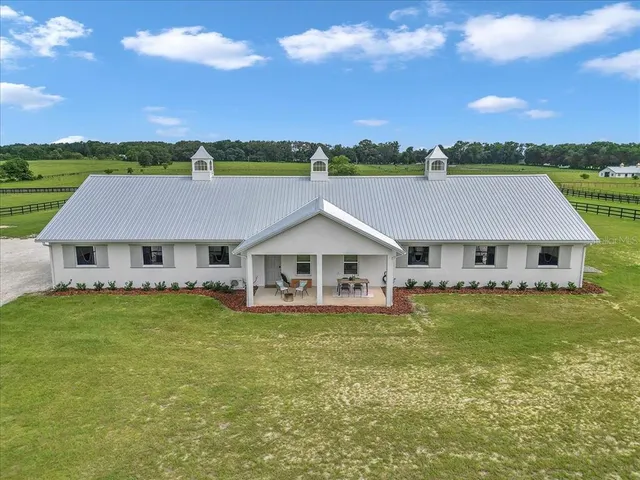 an aerial view of a house with a garden
