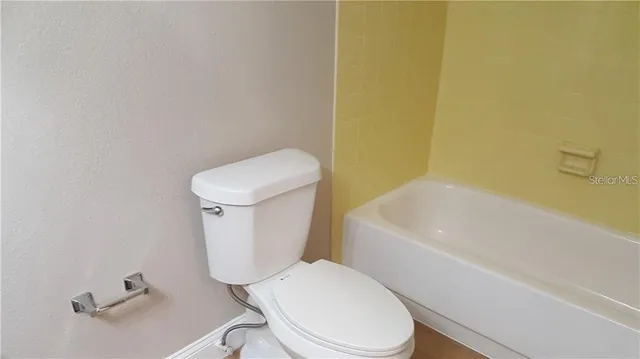 an empty room with windows and a yard