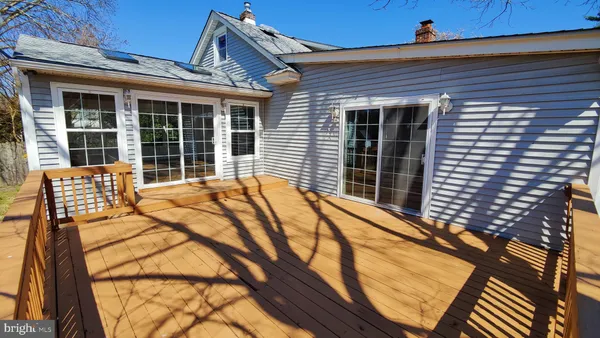 a balcony with a table and chairs