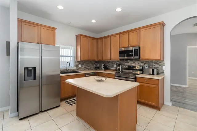 a bedroom with a bed and wall painting