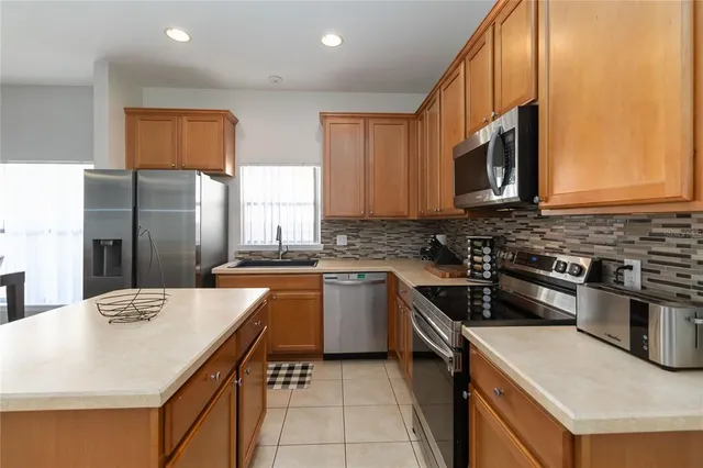 a view of a backyard with swimming pool