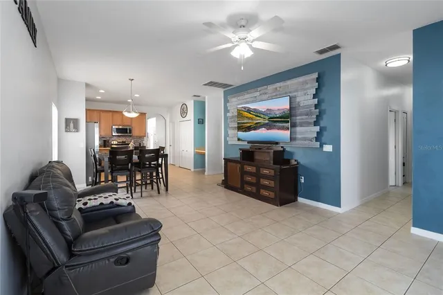 a view of a swimming pool with lounge chairs in patio