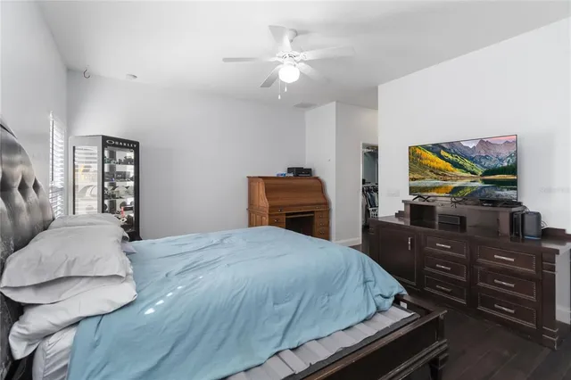 a view of a swimming pool with lounge chairs in patio