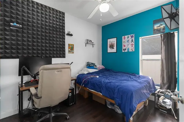 a bedroom with a bed and a window