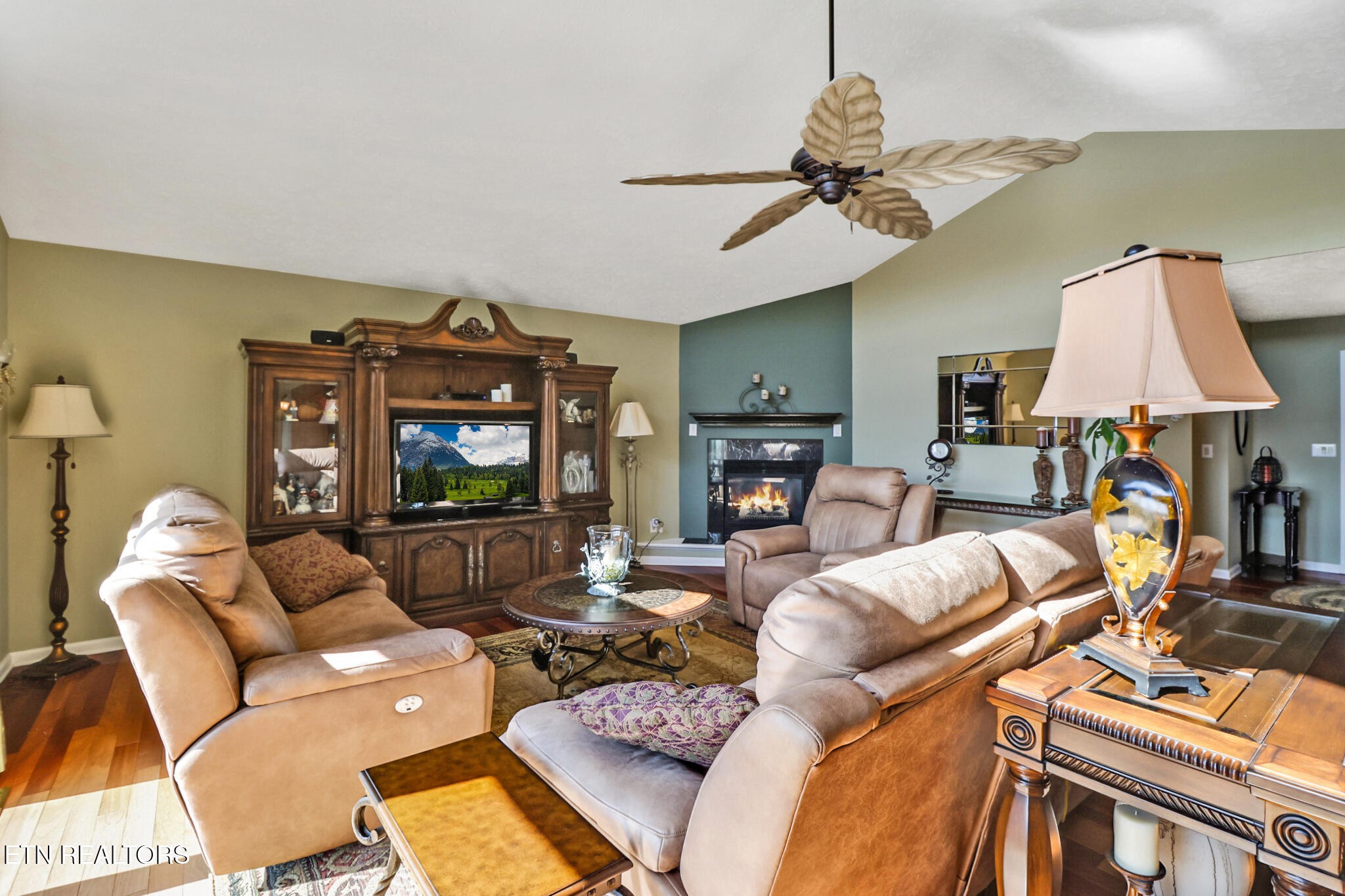 16 Victoria Way Crossville, TN 38558 - Photo 13 of 60 a living room with furniture a fireplace and a flat screen tv