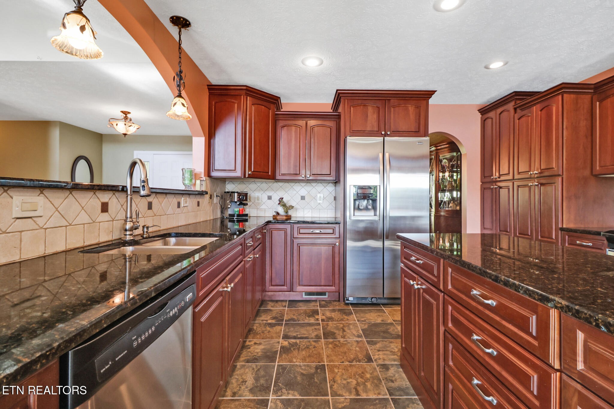 16 Victoria Way Crossville, TN 38558 - Photo 17 of 60 a kitchen with stainless steel appliances granite countertop a sink stove and refrigerator