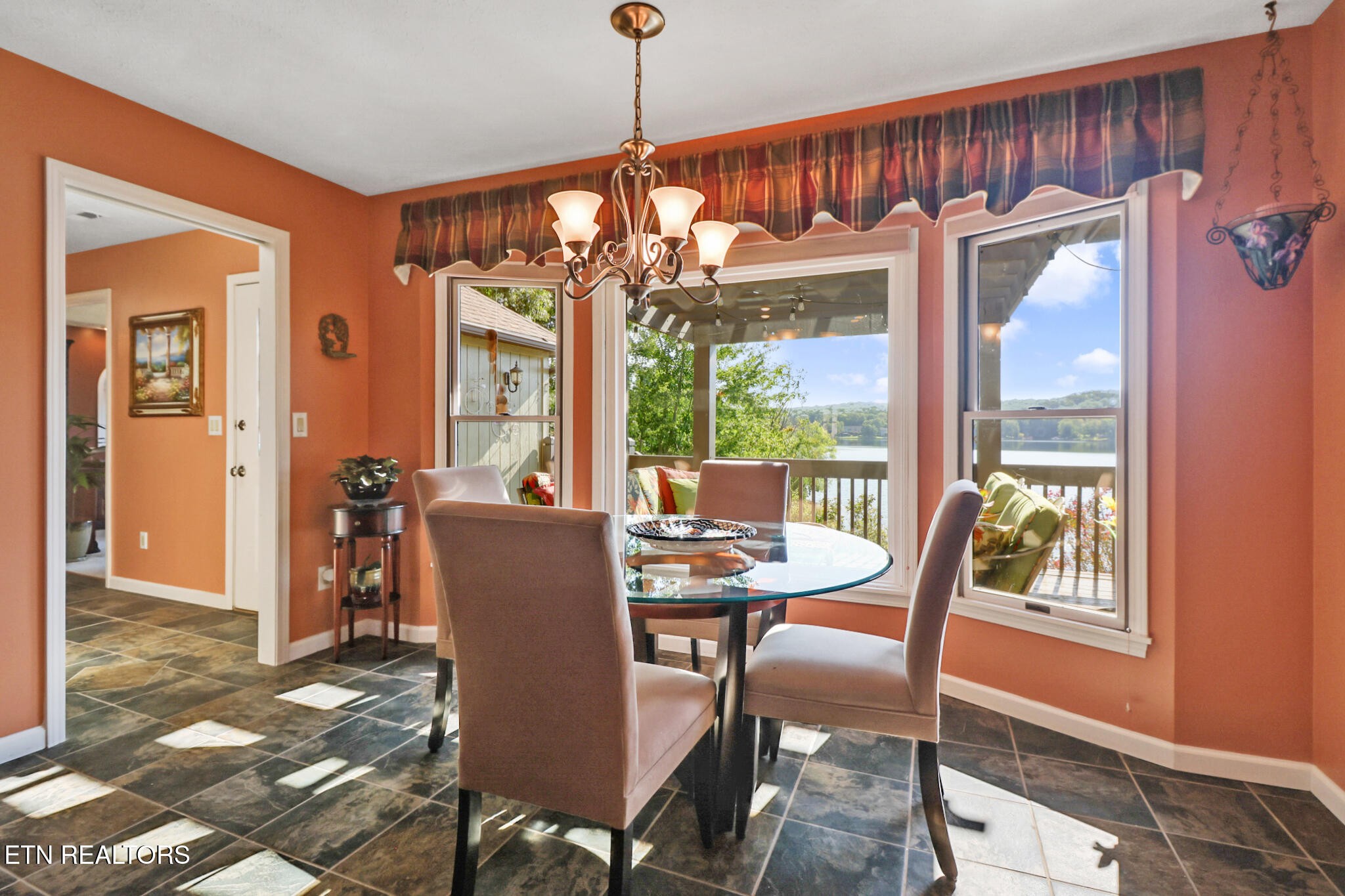 16 Victoria Way Crossville, TN 38558 - Photo 19 of 60 a dining room with furniture a chandelier and wooden floor