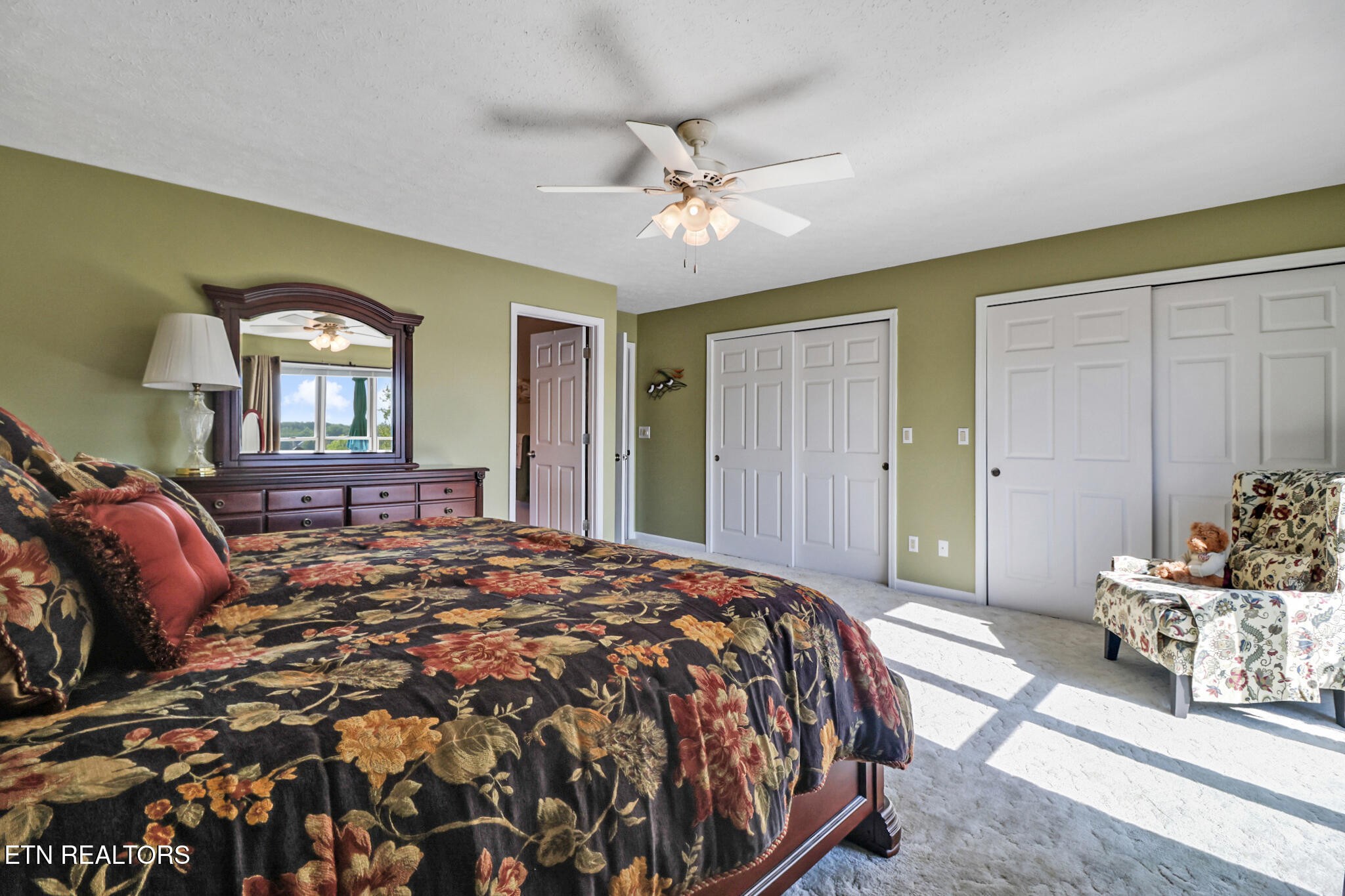 16 Victoria Way Crossville, TN 38558 - Photo 22 of 60 a spacious bedroom with a bed and window