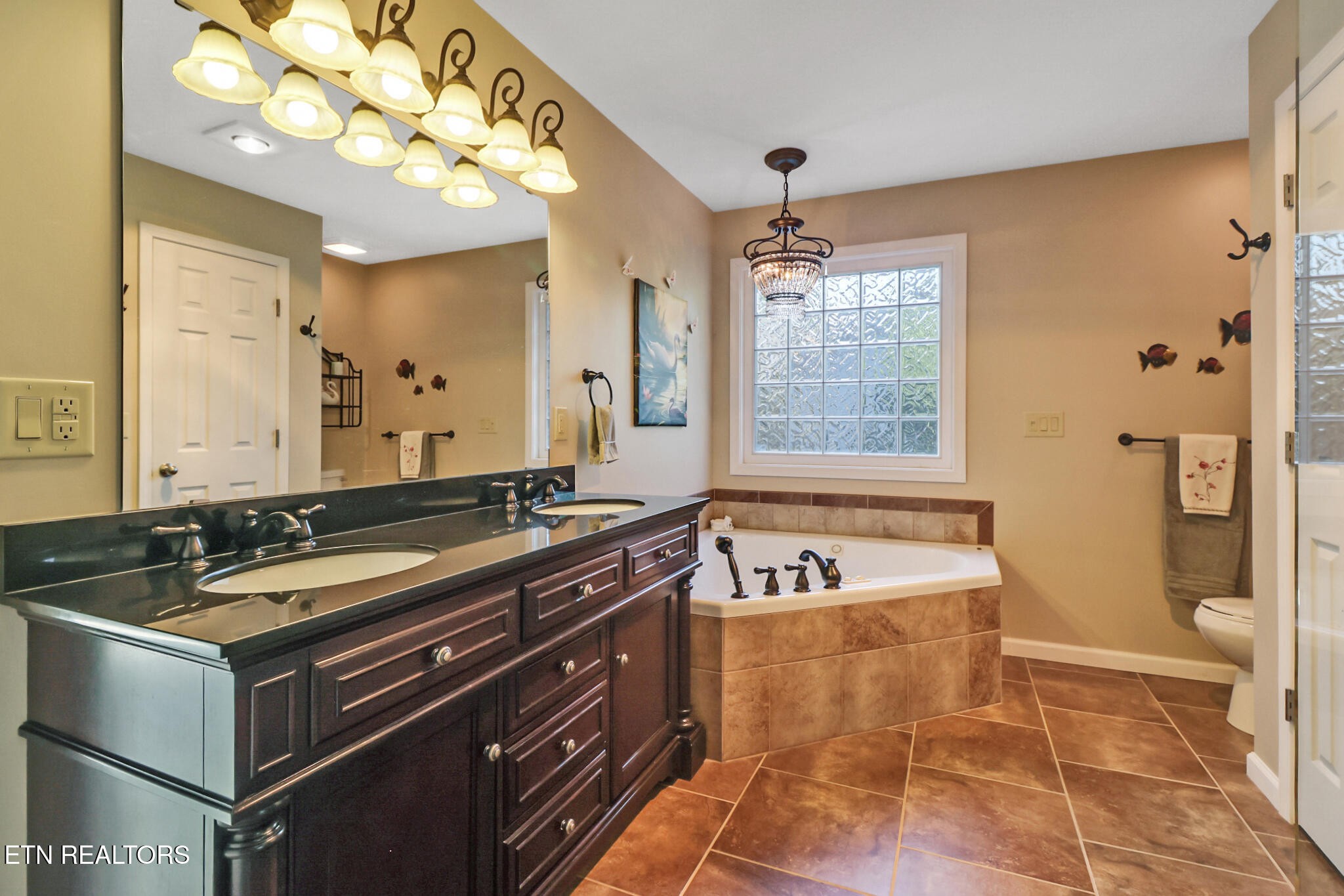 16 Victoria Way Crossville, TN 38558 - Photo 23 of 60 a bath room with a sink tub vanity and a shower