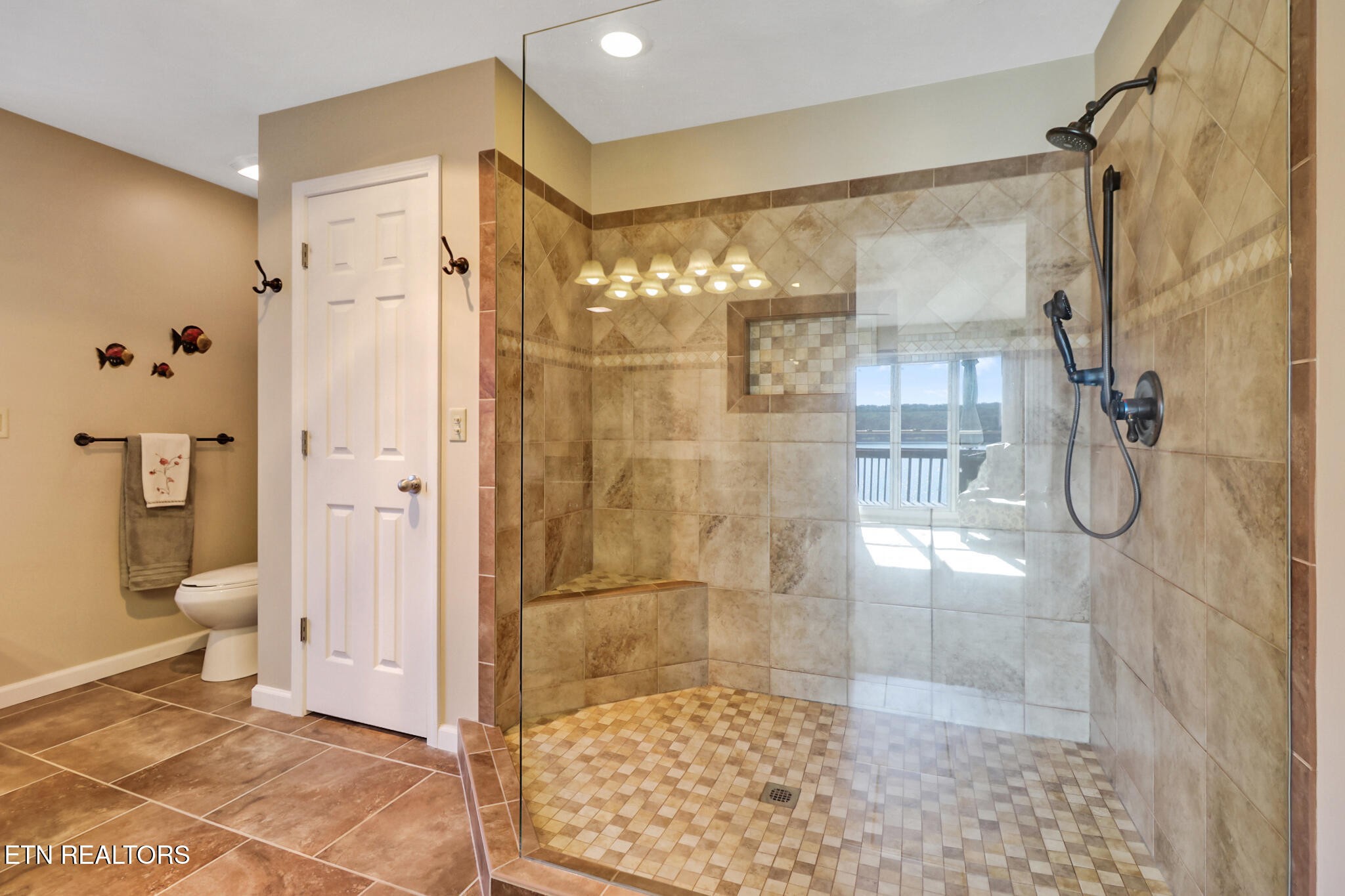 16 Victoria Way Crossville, TN 38558 - Photo 24 of 60 a bathroom with a glass shower door