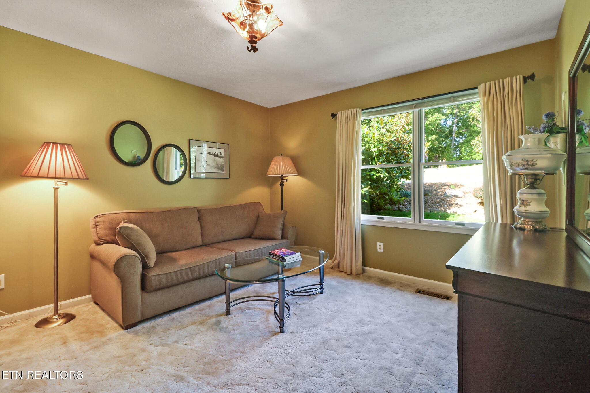 16 Victoria Way Crossville, TN 38558 - Photo 27 of 60 a living room with furniture and a large window