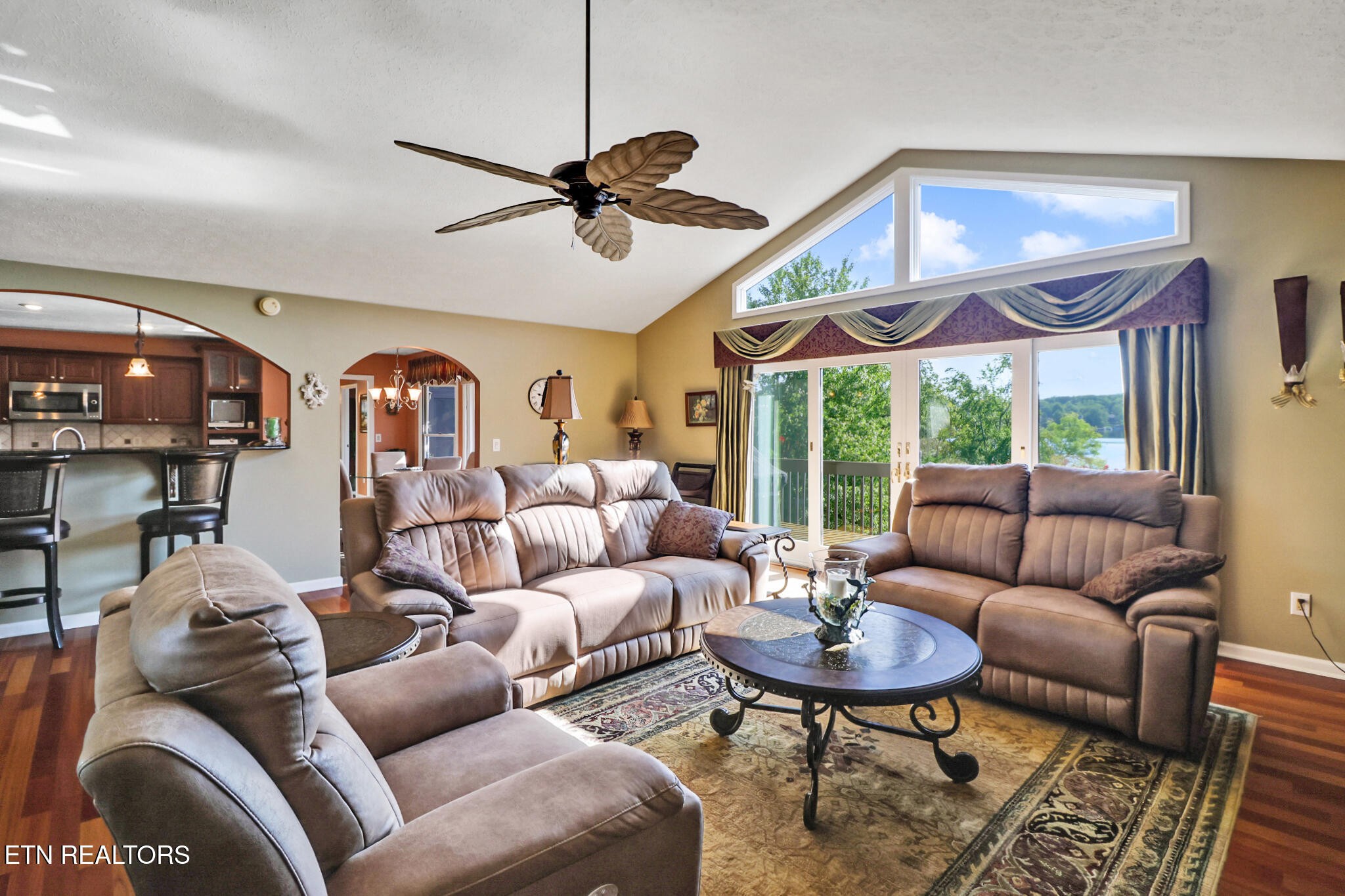 16 Victoria Way Crossville, TN 38558 - Photo 3 of 60 a living room with furniture a ceiling fan and a large window