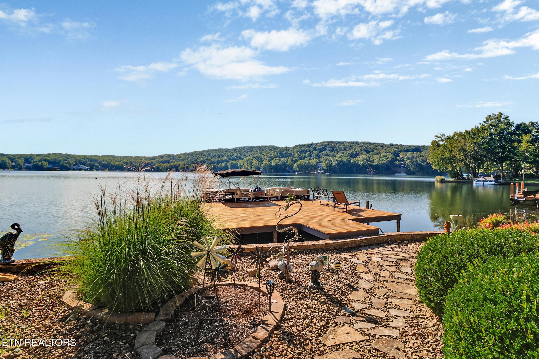 16 Victoria Way Crossville, TN 38558 - Photo 52 of 60 a view of a lake with houses in front of it
