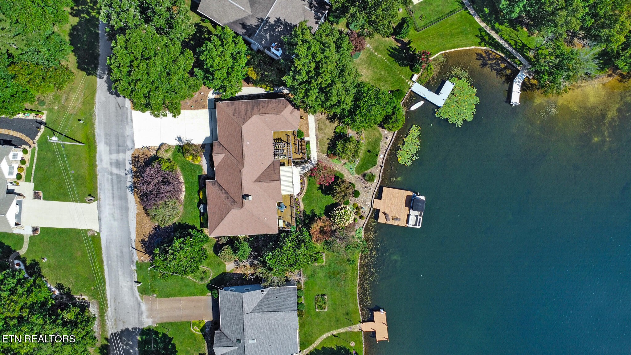 16 Victoria Way Crossville, TN 38558 - Photo 58 of 60 an aerial view of a house with a yard basket ball court and a fountain