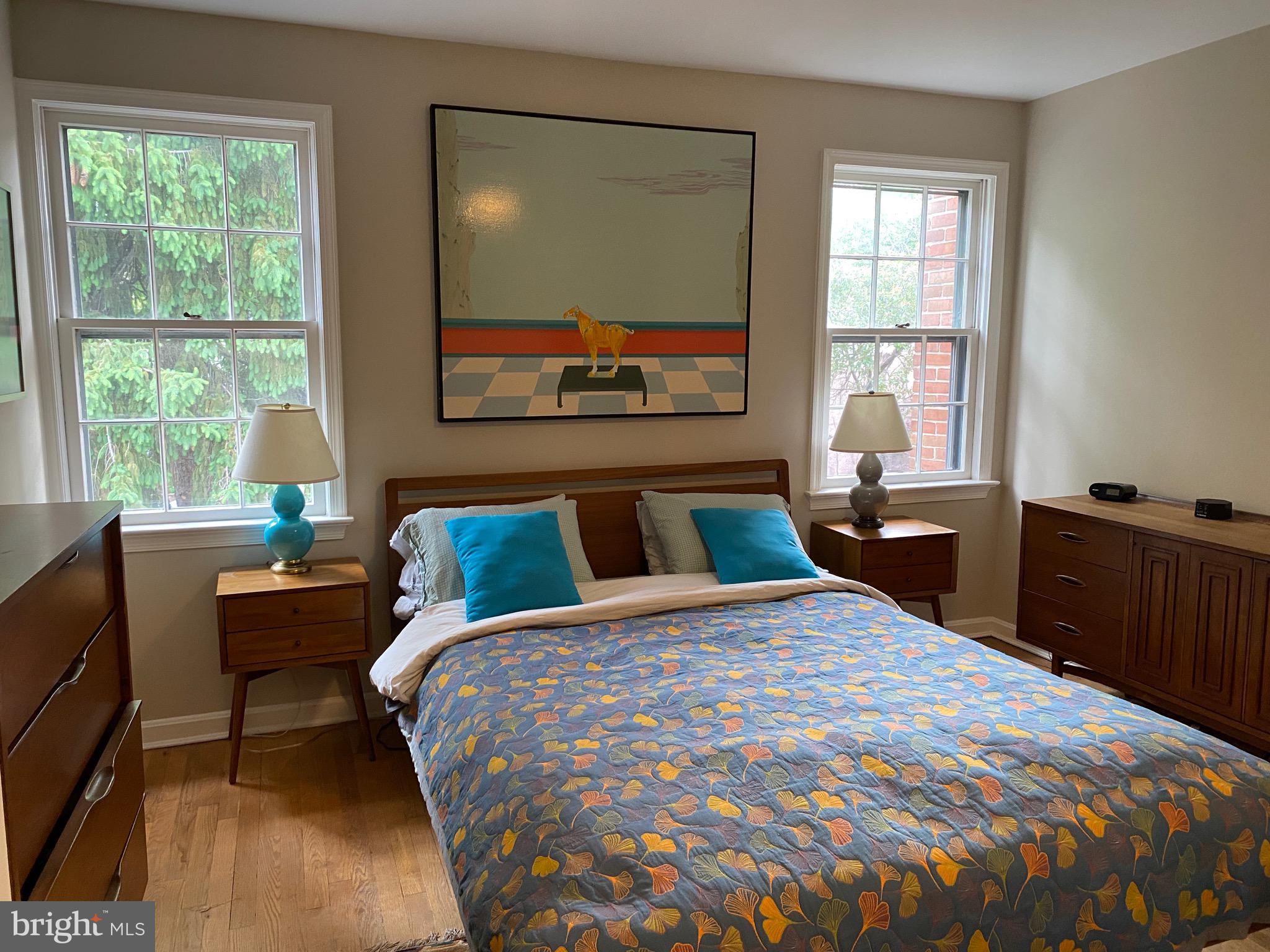 339 11th Street Southeast Washington, DC 20003 - Photo 25 of 39 a bed sitting in a bedroom next to a window