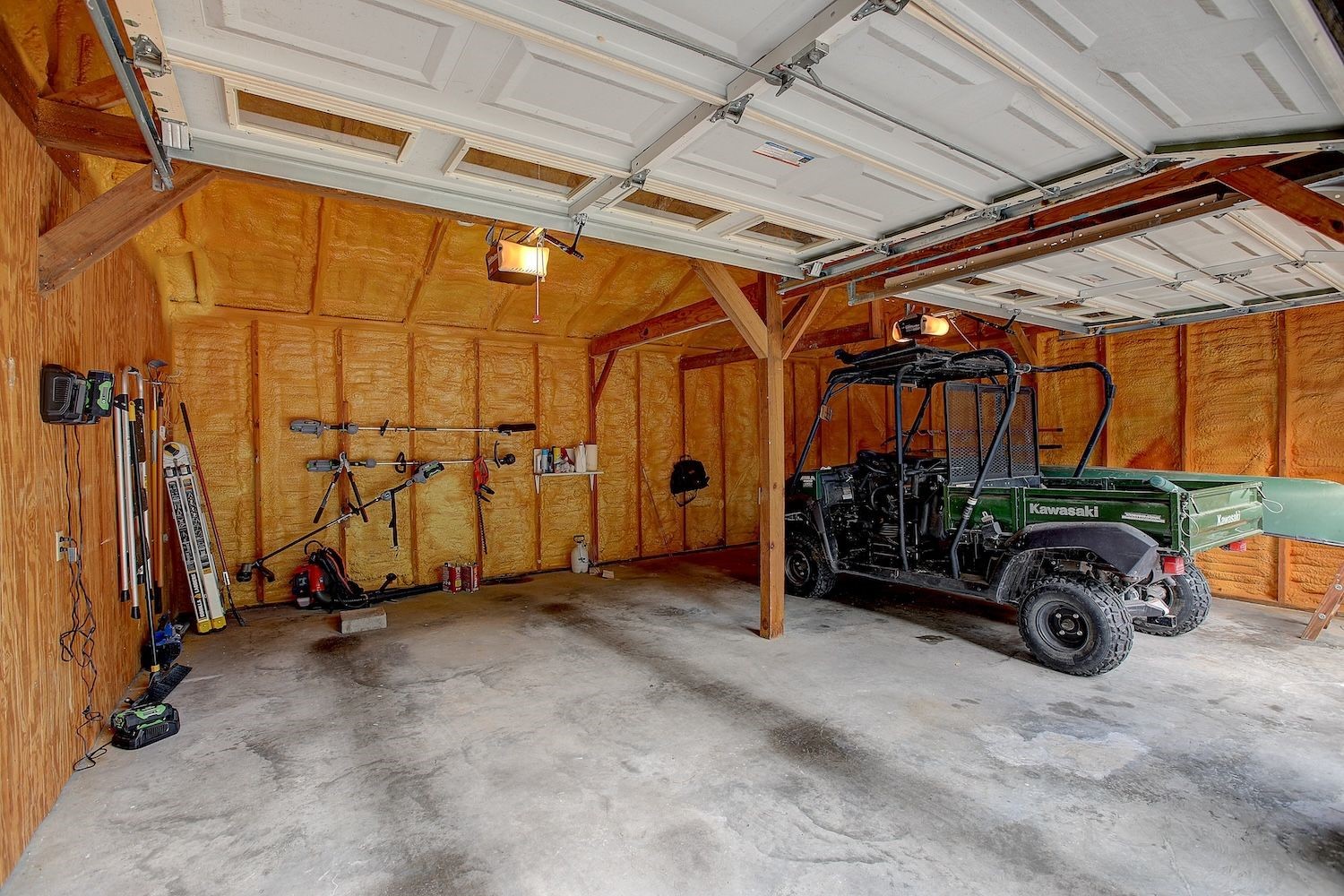 4540 Creamer Creek Road La Grange, TX 78945 - Photo 21 of 32 Interior area of the insulated garage with 2 automatic garage door openers.