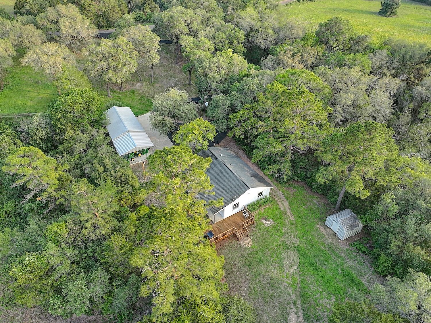 4540 Creamer Creek Road La Grange, TX 78945 - Photo 28 of 32 Aerial of the homesite showing vast trees and the sellers love of caretaking.