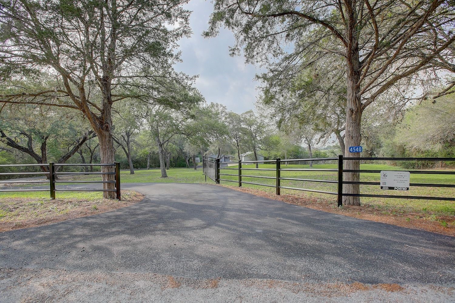4540 Creamer Creek Road La Grange, TX 78945 - Photo 3 of 32 Gateway into the winding driveway leading to the home/garage area. Secure and private.