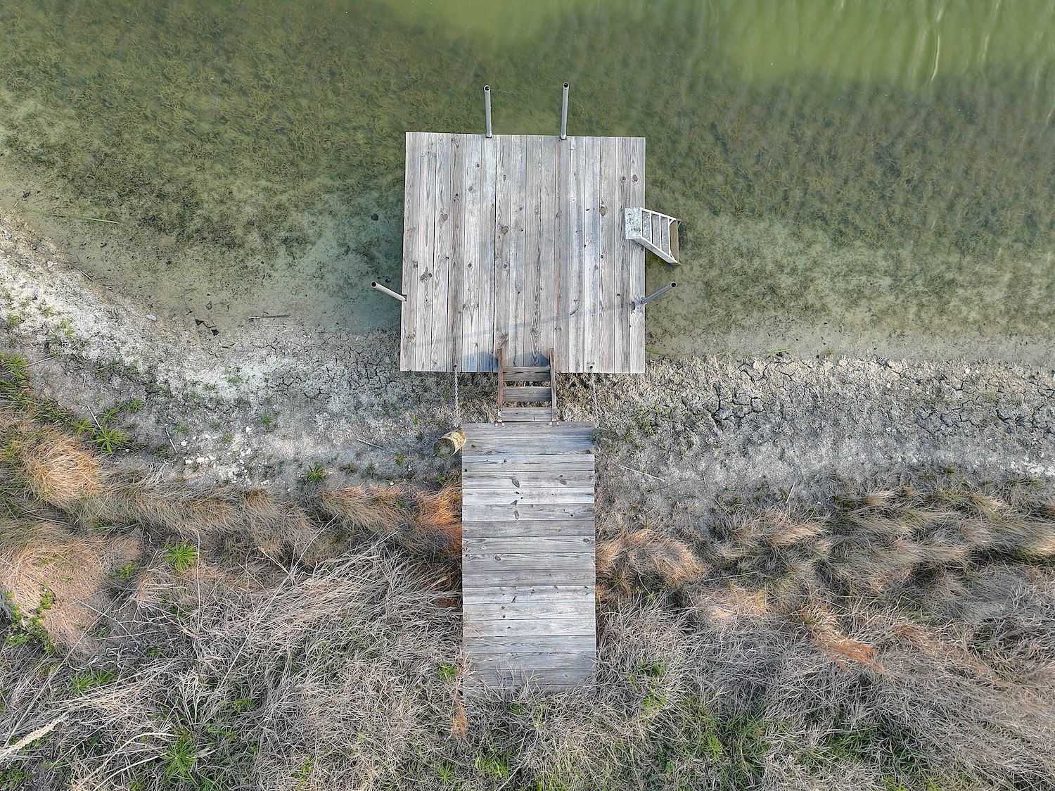 4540 Creamer Creek Road La Grange, TX 78945 - Photo 32 of 32 Aerial of the most recent pontoon pier. The ponds are filling up fast with our recent rains. The fish, birds, and deer are loving it! Rumor has it there is an eagle family living in the area.
