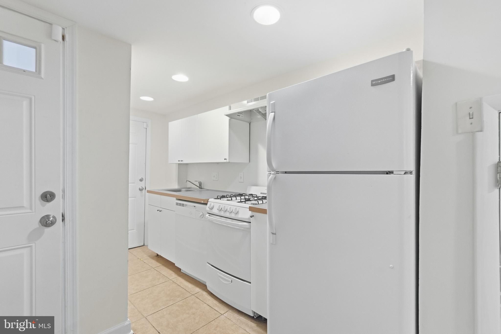 440 Delafield Place Northwest Washington, DC 20011 - Photo 25 of 33 a kitchen with a refrigerator and a stove