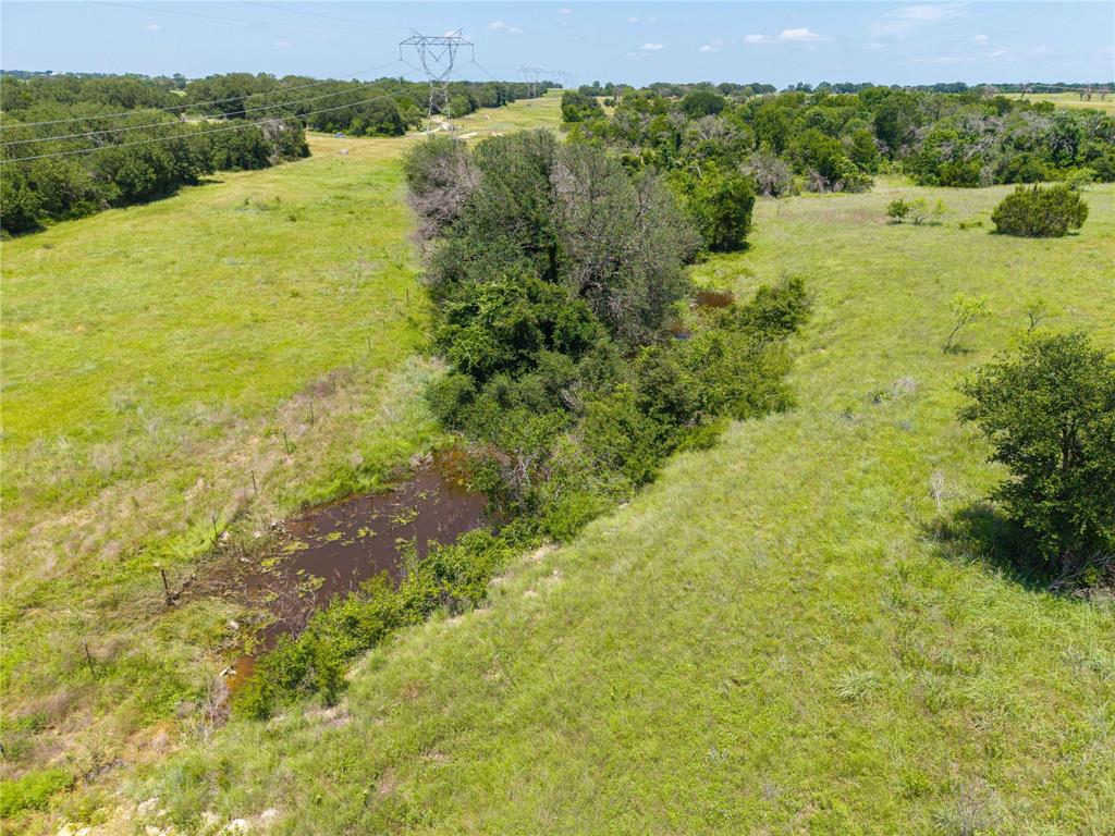 3885 County Road 522 Dublin, TX 76446 - Photo 20 of 30 a view of a green field with a lake