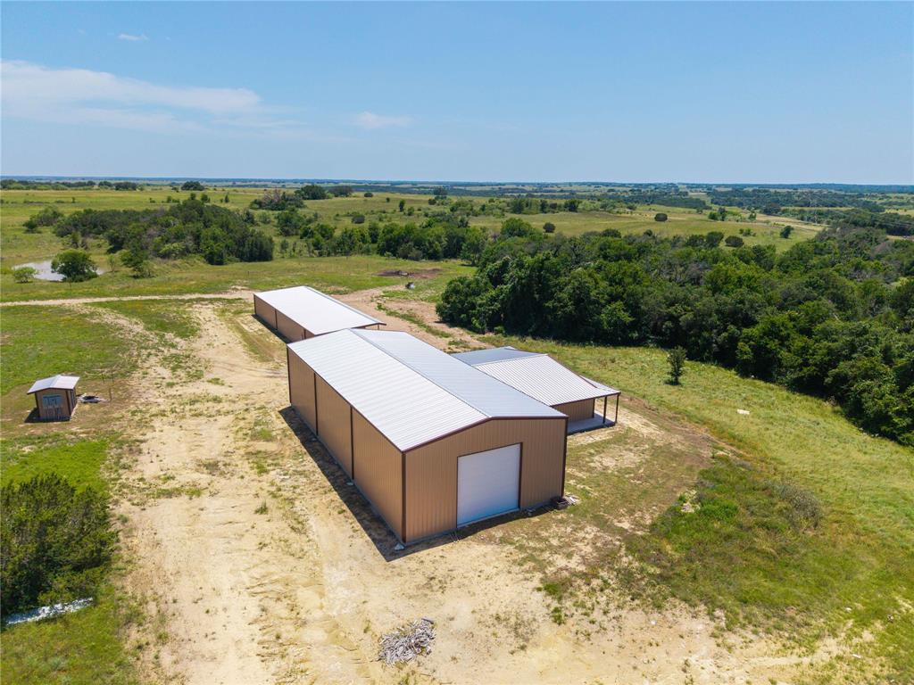 3885 County Road 522 Dublin, TX 76446 - Photo 5 of 30 an aerial view of a house with a yard and lake view